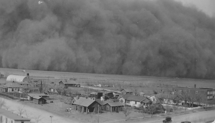 Dark dust cloud approaching a town in Kansas in 1935.