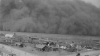Dark dust cloud approaching a town in Kansas in 1935.